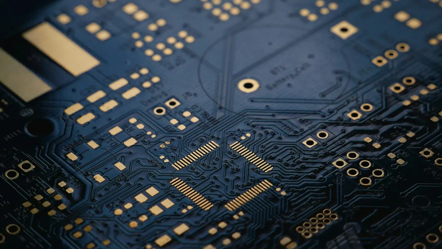 A close-up of a dark blue circuit board